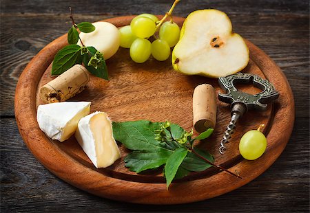 simsearch:400-05682309,k - Wine frame background. Cheese and fruit on a wooden serving board. Stock Photo - Budget Royalty-Free & Subscription, Code: 400-07675906
