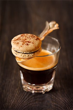 Espresso coffee and sweet chocolate macaron for breakfast. Photographie de stock - Aubaine LD & Abonnement, Code: 400-07675927