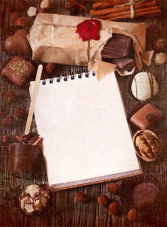 praline - Chocolate and spices frame with notebook for text on a wooden background. Textured toned photo. Stock Photo - Budget Royalty-Free & Subscription, Code: 400-07675935