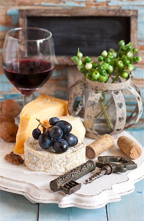 Still life with delicious cheese, red wine, fruits and nuts. Stock Photo - Budget Royalty-Free & Subscription, Code: 400-07675979