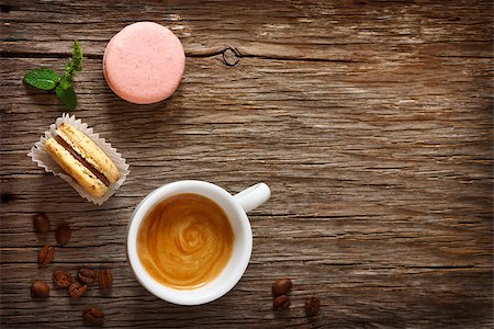 Cup of coffee with chocolate and fruit macarons on wooden background with copy space for text. Stock Photo - Budget Royalty-Free & Subscription, Code: 400-07675999