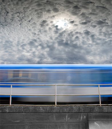 studio023 (artist) - speeding train, a blurred line under gray skies Stockbilder - Microstock & Abonnement, Bildnummer: 400-07676089