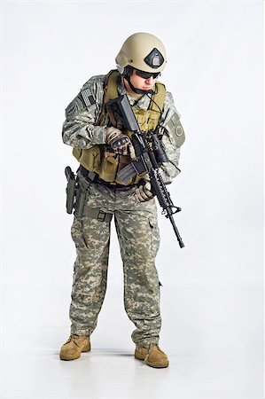 simsearch:400-05087104,k - SWAT Team Officer on white isolated background Stock Photo - Budget Royalty-Free & Subscription, Code: 400-07676875