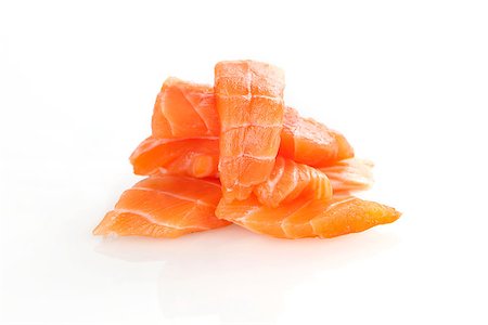 simsearch:400-07039898,k - Sashimi sushi. Raw salmon pieces arranged on white background. Foto de stock - Royalty-Free Super Valor e Assinatura, Número: 400-07677129