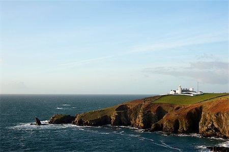 Scenic view of the coastline at Lizard Point, Lizard Peninsula, Cornwall with its historic lighthouse which marks the southernmost point in England overlooking the English Channel Photographie de stock - Aubaine LD & Abonnement, Code: 400-07677494