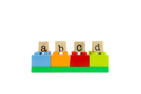simsearch:614-06718261,k - abcd word on wood stamps stack on colorful toy blocks, playing and learning language concepts Photographie de stock - Aubaine LD & Abonnement, Code: 400-07677577