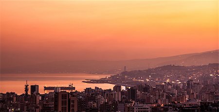 Beautiful red sunset on mountain city, evening cityscape, mediterranean sea, travel and tourism concept Foto de stock - Super Valor sin royalties y Suscripción, Código: 400-07677784