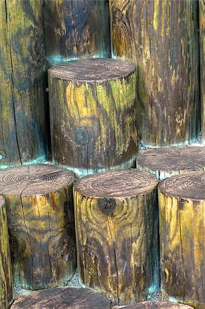 Round wooden timbers are staggered in heights to form unusual steps.  Wood is weathered and stained with yellow and blue. Stock Photo - Budget Royalty-Free & Subscription, Code: 400-07677895