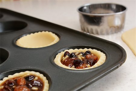 simsearch:400-07677933,k - Closeup of pastry case filled with traditional mincemeat, with cutter beyond Stock Photo - Budget Royalty-Free & Subscription, Code: 400-07677935