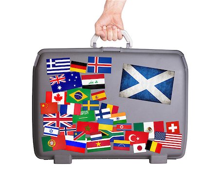 scotish - Used plastic suitcase with lots of small stickers, large sticker of Scotland Stock Photo - Budget Royalty-Free & Subscription, Code: 400-07678226