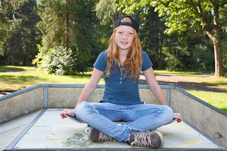 Cool young girl outdoor with skateboard Stock Photo - Budget Royalty-Free & Subscription, Code: 400-07678538