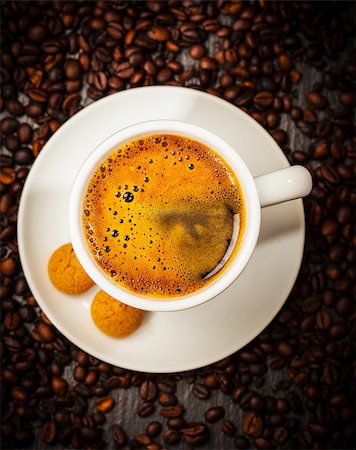 Espresso cup in coffee beans - top view Stock Photo - Budget Royalty-Free & Subscription, Code: 400-07678639