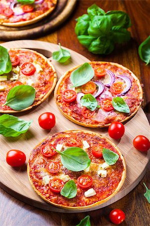 simsearch:400-07465860,k - Traditional pizza with mozzarella, salami and basil Stock Photo - Budget Royalty-Free & Subscription, Code: 400-07678656