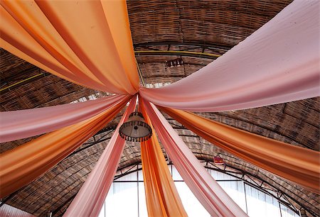 Colorful satin on the top of bamboo roof. Foto de stock - Royalty-Free Super Valor e Assinatura, Número: 400-07678713