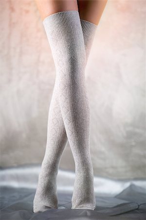 socks feet - Beautiful woman legs in cotton stockings Stock Photo - Budget Royalty-Free & Subscription, Code: 400-07678908