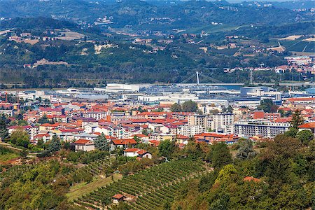 Red roofs of of Alba - town situated among green hills of Langhe in Piedmont, Northern Italy (view from above). Stock Photo - Budget Royalty-Free & Subscription, Code: 400-07679252