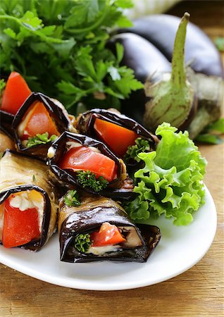 sauteeing - vegetable saute fried eggplant rolls with tomatoes Photographie de stock - Aubaine LD & Abonnement, Code: 400-07679784