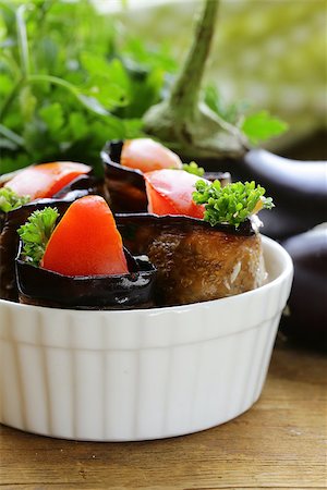sauteeing - vegetable saute fried eggplant rolls with tomatoes Photographie de stock - Aubaine LD & Abonnement, Code: 400-07679783