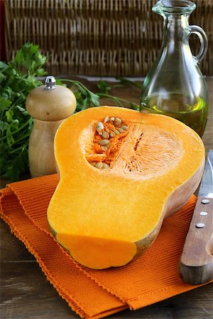 simsearch:400-05714074,k - fresh raw pumpkin sliced on a wooden table Photographie de stock - Aubaine LD & Abonnement, Code: 400-07679791