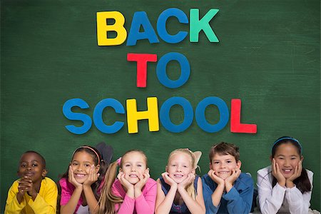 Cute pupils smiling at camera against green chalkboard with back to school message Stock Photo - Budget Royalty-Free & Subscription, Code: 400-07684008