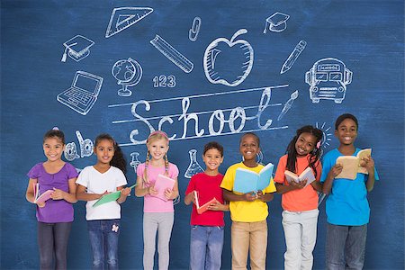 simsearch:400-07683620,k - Elementary pupils reading books against blue chalkboard with back to school message Foto de stock - Royalty-Free Super Valor e Assinatura, Número: 400-07684009