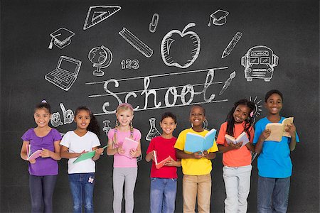 simsearch:400-07684098,k - Elementary pupils reading books against black wall with school doodles Stock Photo - Budget Royalty-Free & Subscription, Code: 400-07684011