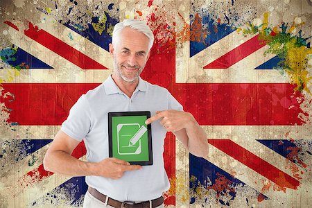 simsearch:400-06876753,k - Mature student showing tablet pc against grunge union jack flag Photographie de stock - Aubaine LD & Abonnement, Code: 400-07684045