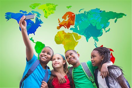 simsearch:400-07684082,k - Cute pupils taking a selfie against green vignette with world map Stock Photo - Budget Royalty-Free & Subscription, Code: 400-07684144