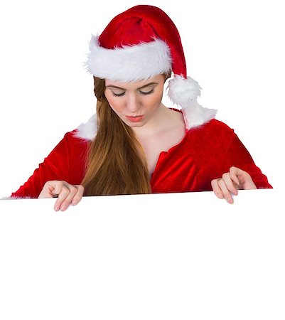 simsearch:693-06021827,k - Pretty girl in santa costume showing card on white background Foto de stock - Super Valor sin royalties y Suscripción, Código: 400-07684244