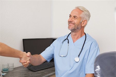 pictures of two nurses shaking hands - Dentist shaking hands with his patient at the dental clinic Stock Photo - Budget Royalty-Free & Subscription, Code: 400-07684774