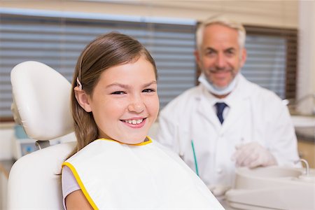 simsearch:400-07684901,k - Pediatric dentist and little girl smiling at camera at the dental clinic Stock Photo - Budget Royalty-Free & Subscription, Code: 400-07684880