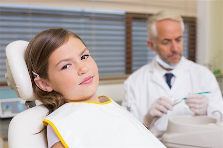 simsearch:400-07684901,k - Little girl sitting in dentists chair at the dental clinic Stock Photo - Budget Royalty-Free & Subscription, Code: 400-07684883