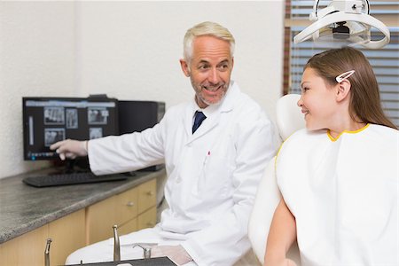 dental explanation - Dentist explaining xrays to little girl at the dental clinic Stock Photo - Budget Royalty-Free & Subscription, Code: 400-07684905