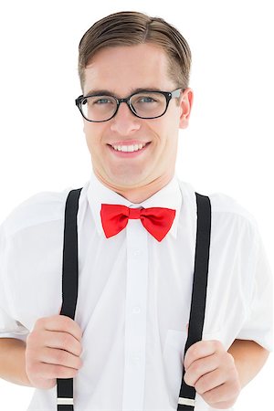 pulling on bow tie - Nerdy hipster pulling his suspenders on white background Stock Photo - Budget Royalty-Free & Subscription, Code: 400-07685553