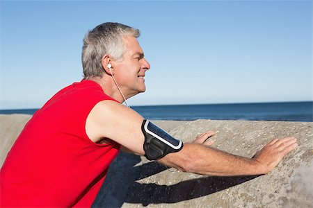 Active senior man stretching before a jog on a sunny day Stock Photo - Budget Royalty-Free & Subscription, Code: 400-07685693