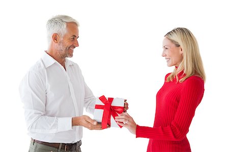 simsearch:400-07726699,k - Smiling couple holding a gift on white background Foto de stock - Super Valor sin royalties y Suscripción, Código: 400-07685902