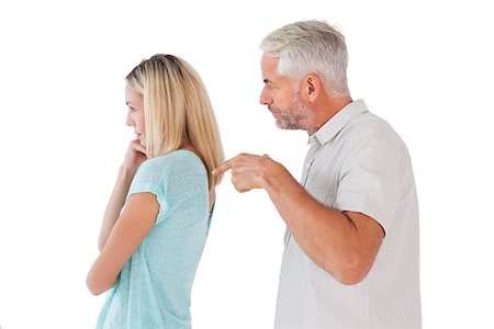 simsearch:400-07726420,k - Angry man pointing at his wife on white background Fotografie stock - Microstock e Abbonamento, Codice: 400-07685935