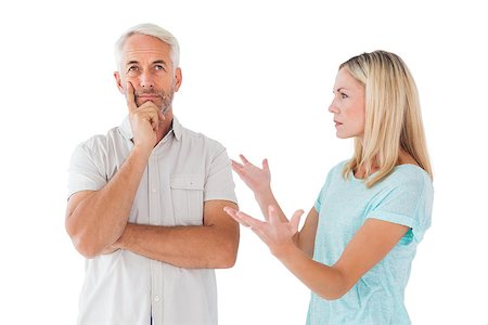 simsearch:400-07726578,k - Unhappy couple having an argument with man not listening on white background Fotografie stock - Microstock e Abbonamento, Codice: 400-07685933