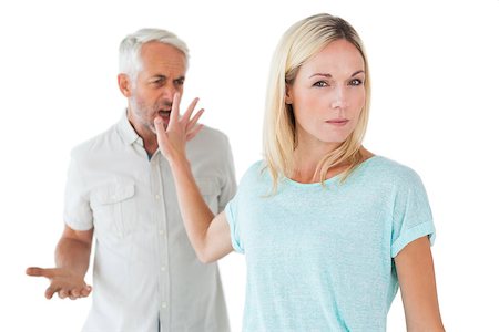 simsearch:400-07726578,k - Woman not listening to her angry partner on white background Fotografie stock - Microstock e Abbonamento, Codice: 400-07685945