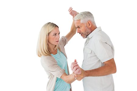 simsearch:400-07726420,k - Angry man overpowering his partner on white background Fotografie stock - Microstock e Abbonamento, Codice: 400-07685947