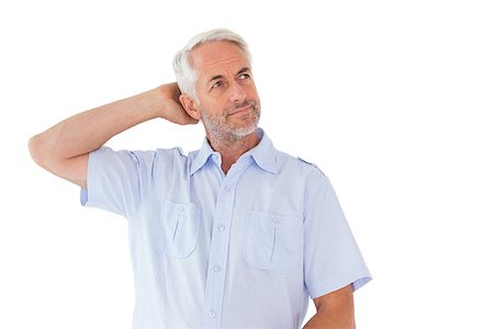 Thinking man posing with hand behind head on white background Photographie de stock - Aubaine LD & Abonnement, Code: 400-07686005