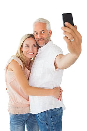 Happy couple posing for a selfie on white background Stock Photo - Budget Royalty-Free & Subscription, Code: 400-07686044