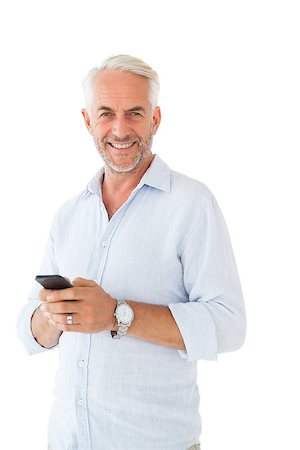 Smiling man sending a text message on white background Stock Photo - Budget Royalty-Free & Subscription, Code: 400-07686074