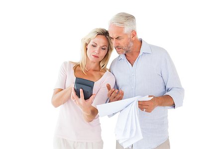 Anxious couple working out their bills on white background Stock Photo - Budget Royalty-Free & Subscription, Code: 400-07686127