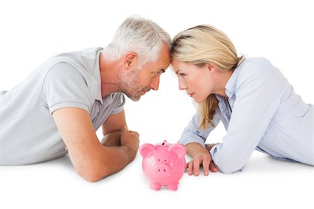 pictures of man lying on money - Happy couple lying with piggy bank on white background Stock Photo - Budget Royalty-Free & Subscription, Code: 400-07686184