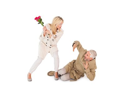 simsearch:400-07685942,k - Angry woman attacking partner with rose bouquet on white background Photographie de stock - Aubaine LD & Abonnement, Code: 400-07686257
