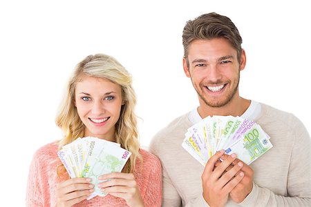 flashing - Attractive couple flashing their cash on white background Foto de stock - Super Valor sin royalties y Suscripción, Código: 400-07686329