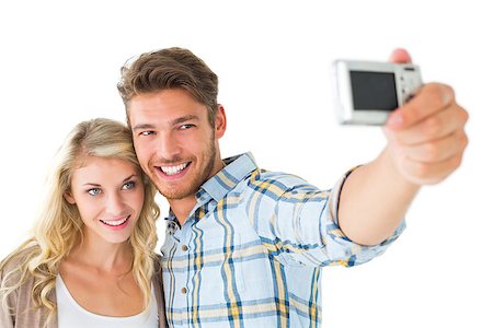 stylish people taking photos - Attractive couple taking a selfie together on white background Stock Photo - Budget Royalty-Free & Subscription, Code: 400-07686343