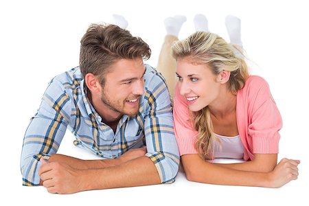 Attractive young couple smiling at each other on white background Foto de stock - Super Valor sin royalties y Suscripción, Código: 400-07686447
