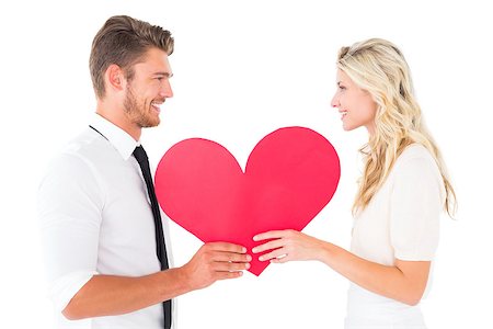 simsearch:400-07686534,k - Attractive young couple holding red heart on white background Foto de stock - Royalty-Free Super Valor e Assinatura, Número: 400-07686529